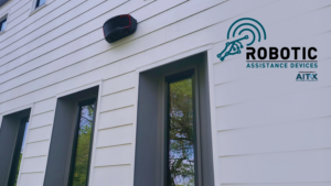 Photograph of a RAD ROSA 3.0 security robot mounted on a residence. RAD has announced that it expects to launch a product into the rapidly expanding residential security market.