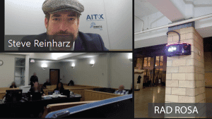 Captured image of AITX and RAD CEO, Steve Reinharz remotely testifying at a criminal hearing regarding security video footage captured of an assault on a Trinity Railway Express train conductor. RAD’s ROSA security robot at the train station is shown.