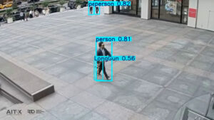 AI-powered analysis of this surveillance image using RAD technology resulted in the identification of a long gun and surrounding individuals, prior to the suspect’s entry into the NYC office tower.